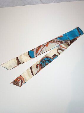 Elegant cream, blue and burnt orange terracotta graphics skinny satin scarf. New